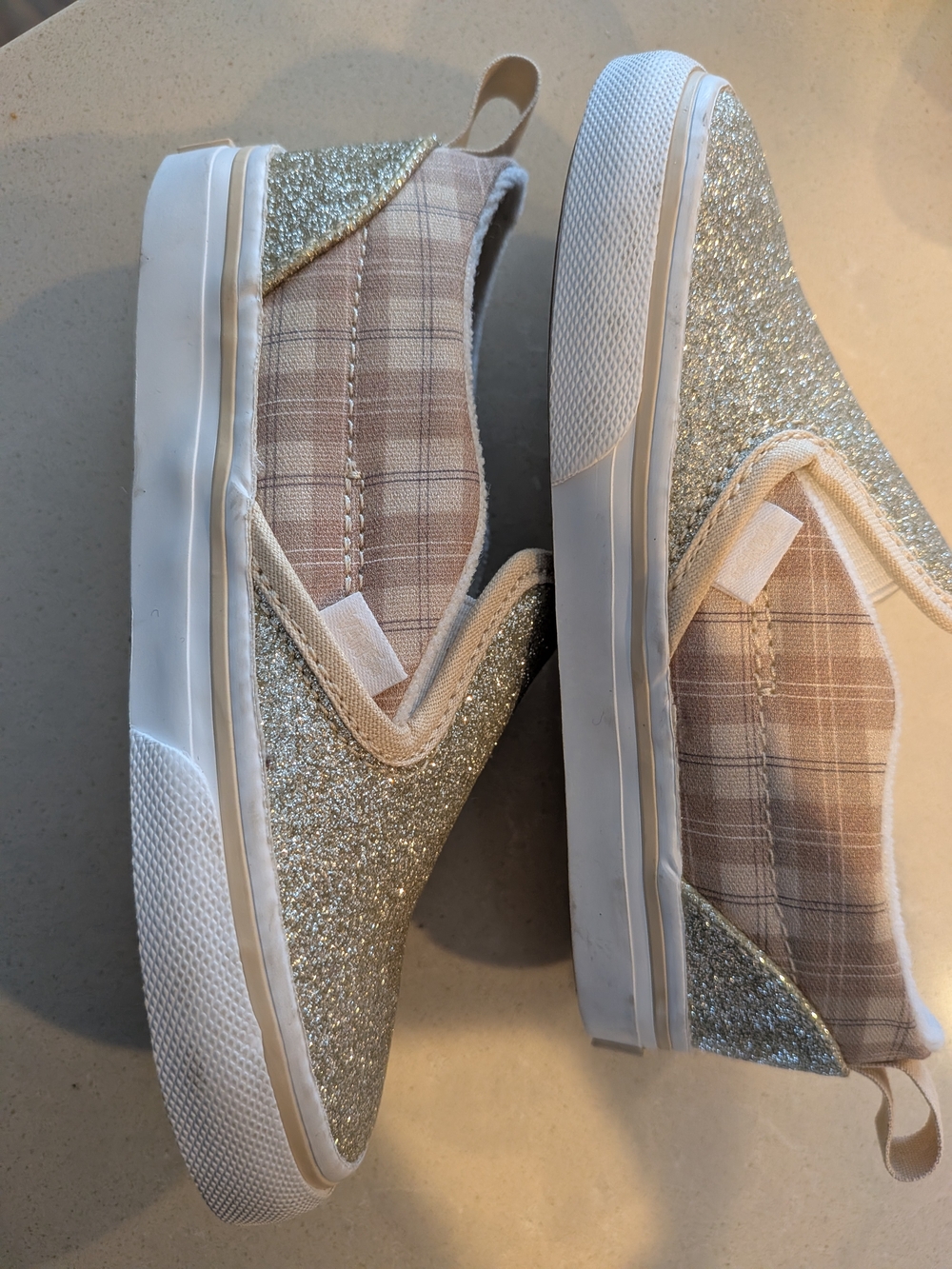 Vans Kids Slip-On Glitter Sneakers in Gold and White